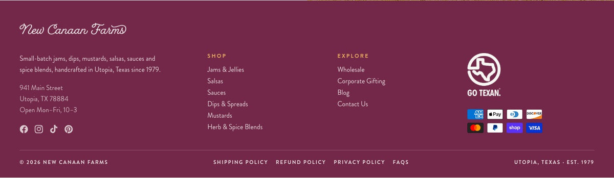 The new site footer in maroon: the New Canaan Farms script logo, the Utopia address and store hours, Shop and Explore menus, the GO TEXAN mark and payment icons.