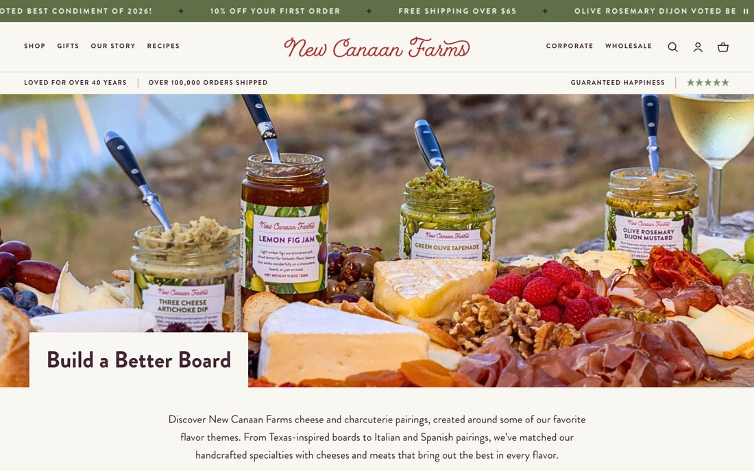 The Build a Better Board landing page on New Canaan Farms: a cheese and charcuterie spread with jars of Lemon Fig Jam, Green Olive Tapenade and Olive Rosemary Dijon Mustard under the heading Build a Better Board.