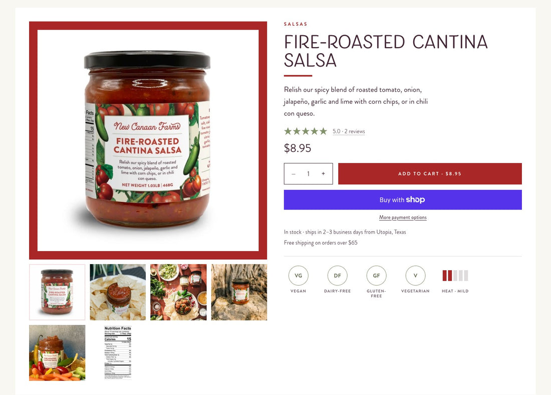 The new buy box for Fire-Roasted Cantina Salsa: the jar inside a thick red frame, thumbnails including the nutrition label, the Salsas category label, the title in tall capitals, a five-star rating, price, quantity stepper, a red Add to Cart button, Shop Pay, shipping notes, and round badges for vegan, dairy-free, gluten-free and vegetarian beside a heat meter reading mild.
